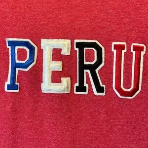 Size small graphic T-shirt. PERU heather red.